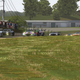 The leaders crest the hill headed into turn 2